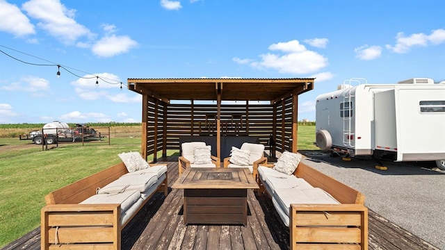 10506 W Smith Rd, El Reno, OK 73036 - wooden terrace featuring an outdoor living space with a fire pit and a yard