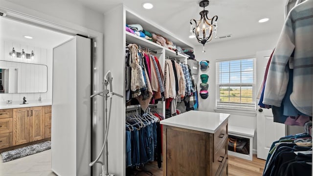 10506 W Smith Rd, El Reno, OK 73036 - spacious closet with a chandelier