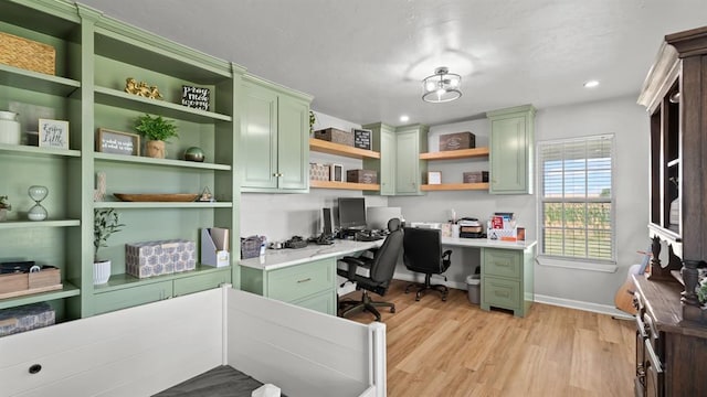 10506 W Smith Rd, El Reno, OK 73036 - home office with built in study area, light wood finished floors, and recessed lighting