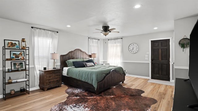 10506 W Smith Rd, El Reno, OK 73036 - bedroom with light wood-type flooring, recessed lighting, and a ceiling fan