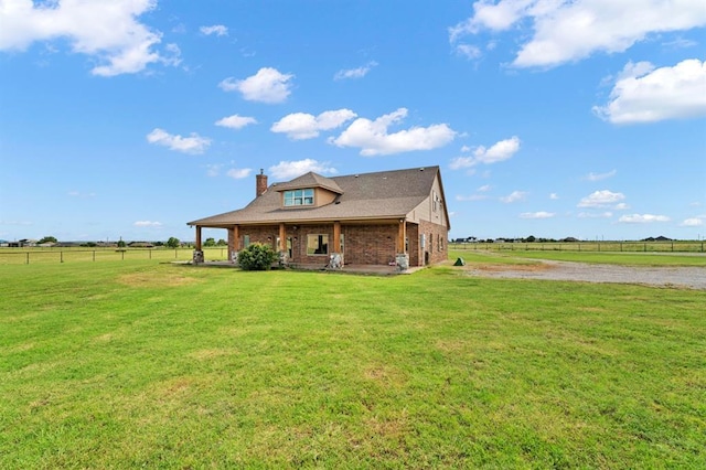 3895 NE Arrowhead Rd, Piedmont, OK 73078 - view of front of property with brick siding, a chimney, covered porch, a view of rural / pastoral area, and driveway