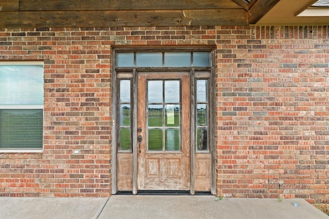 3895 NE Arrowhead Rd, Piedmont, OK 73078 - doorway to property with brick siding