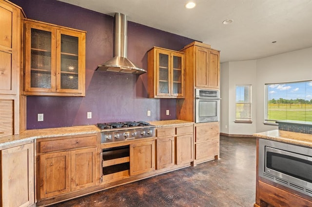 3895 NE Arrowhead Rd, Piedmont, OK 73078 - kitchen with appliances with stainless steel finishes, wall chimney exhaust hood, finished concrete floors, decorative backsplash, and recessed lighting