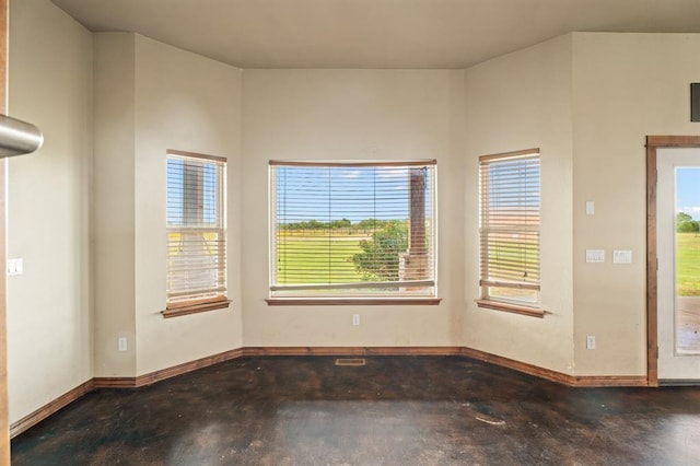 3895 NE Arrowhead Rd, Piedmont, OK 73078 - empty room with concrete flooring and baseboards