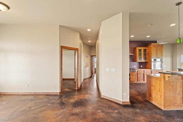 3895 NE Arrowhead Rd, Piedmont, OK 73078 - kitchen featuring appliances with stainless steel finishes, glass insert cabinets, recessed lighting, a kitchen breakfast bar, and decorative light fixtures