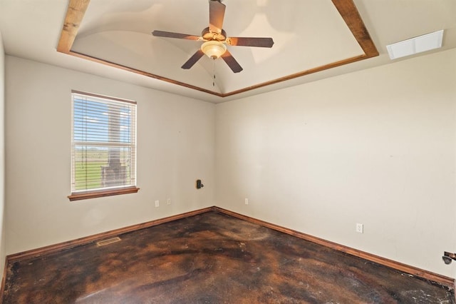 3895 NE Arrowhead Rd, Piedmont, OK 73078 - empty room featuring a raised ceiling, unfinished concrete floors, and ceiling fan