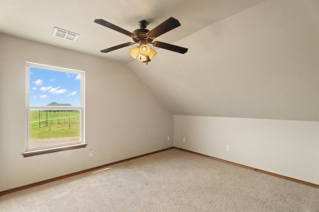 3895 NE Arrowhead Rd, Piedmont, OK 73078 - bonus room with light colored carpet, vaulted ceiling, and a ceiling fan