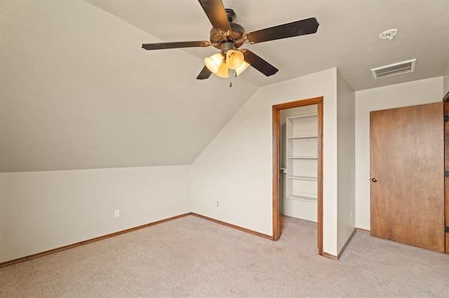 3895 NE Arrowhead Rd, Piedmont, OK 73078 - additional living space with light carpet, a ceiling fan, and vaulted ceiling
