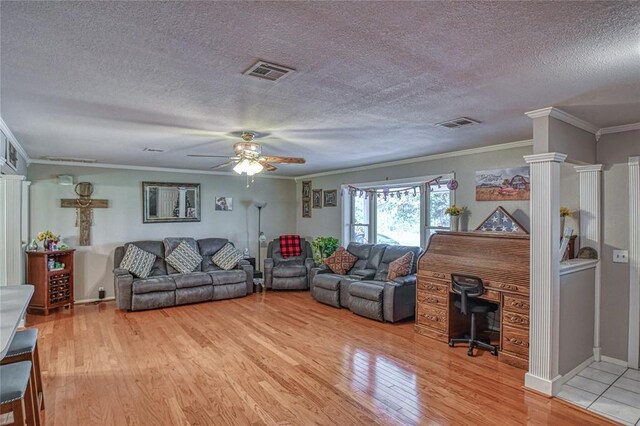 13086 240th, Blanchard, OK 73010 - living area with crown molding, light wood-style flooring, ceiling fan, and a textured ceiling