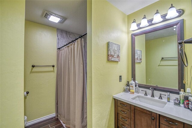 13086 240th, Blanchard, OK 73010 - full bath featuring vanity, a textured wall, a shower with shower curtain, and wood finished floors