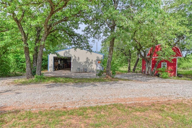 13086 240th, Blanchard, OK 73010 - view of yard featuring a detached garage, an outdoor structure, and a pole building