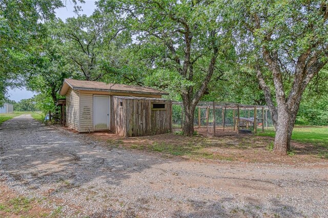 13086 240th, Blanchard, OK 73010 - view of yard featuring an outbuilding and dirt driveway