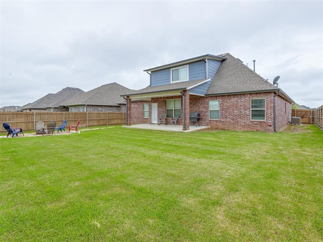 3713 Andrew Ct, Norman, OK 73072 - rear view of property featuring a patio area, central AC unit, roof with shingles, a fire pit, and brick siding