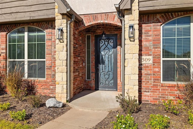 309 Turnberry Dr, Norman, OK 73069 - doorway to property with brick siding