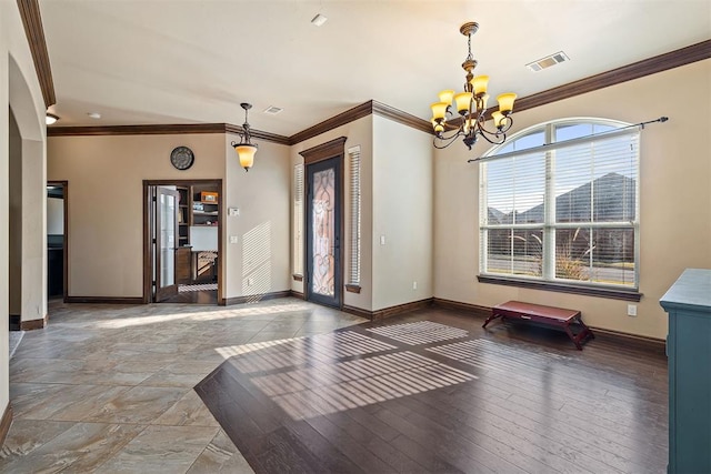 309 Turnberry Dr, Norman, OK 73069 - unfurnished dining area with a chandelier, ornamental molding, and baseboards