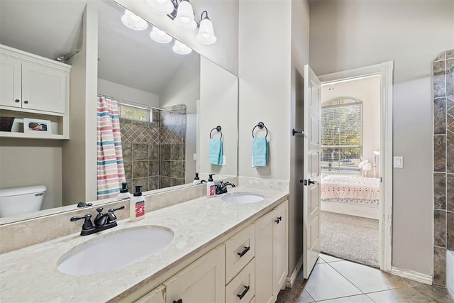 309 Turnberry Dr, Norman, OK 73069 - ensuite bathroom featuring healthy amount of natural light, toilet, double vanity, and tiled shower