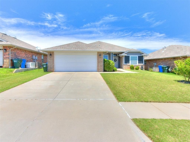 3911 Wiltshire Dr, Norman, OK 73026 - ranch-style house with concrete driveway, an attached garage, brick siding, and a front yard