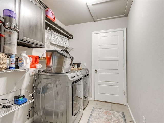 3911 Wiltshire Dr, Norman, OK 73026 - laundry room featuring cabinet space, washer and dryer, attic access, light tile patterned flooring, and baseboards