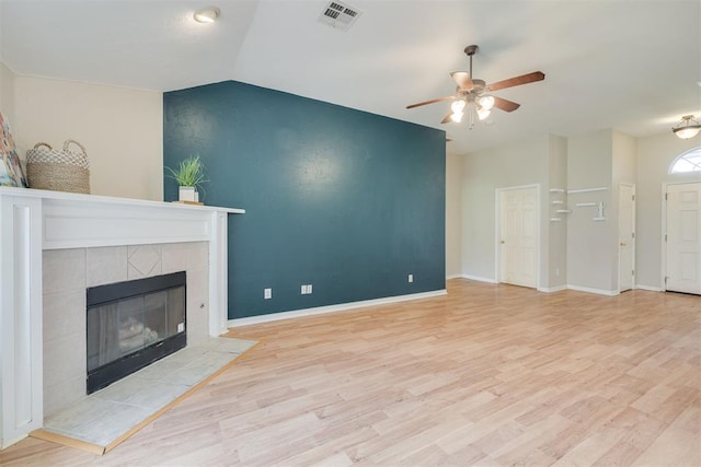 5600 Darla Dr, Oklahoma City, OK 73135 - unfurnished living room with a tile fireplace, wood finished floors, a ceiling fan, and vaulted ceiling