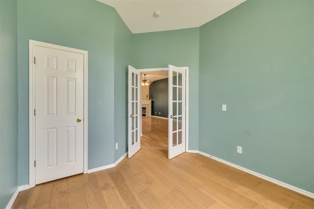 5600 Darla Dr, Oklahoma City, OK 73135 - unfurnished bedroom featuring french doors and light wood-style floors