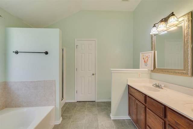 5600 Darla Dr, Oklahoma City, OK 73135 - bathroom with a garden tub, double vanity, and lofted ceiling