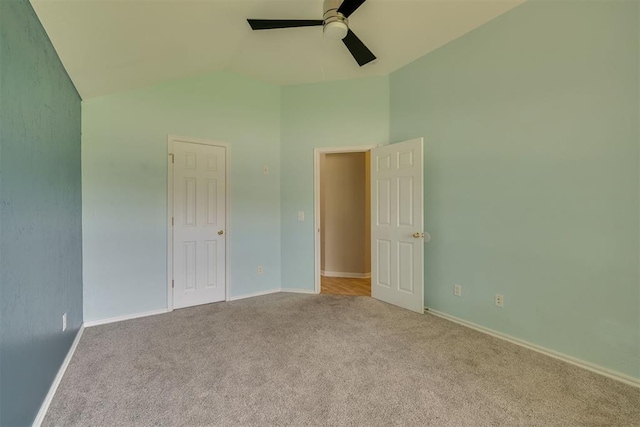 5600 Darla Dr, Oklahoma City, OK 73135 - unfurnished bedroom featuring carpet, lofted ceiling, and a ceiling fan