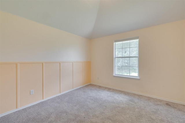 5600 Darla Dr, Oklahoma City, OK 73135 - empty room with carpet, vaulted ceiling, and a wainscoted wall