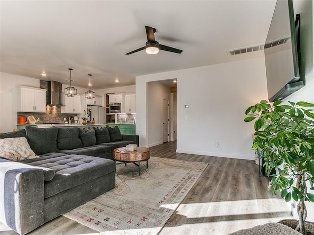 8324 NW 151st Ter, Edmond, OK 73013 - living room with a ceiling fan, wood finished floors, and baseboards