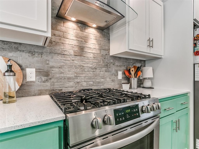 8324 NW 151st Ter, Edmond, OK 73013 - kitchen with stainless steel range with gas stovetop, range hood, tasteful backsplash, white cabinetry, and light stone counters