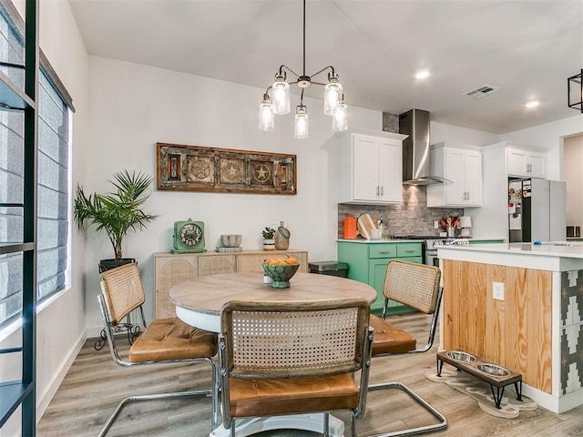 8324 NW 151st Ter, Edmond, OK 73013 - dining space with light wood-style floors, plenty of natural light, and baseboards