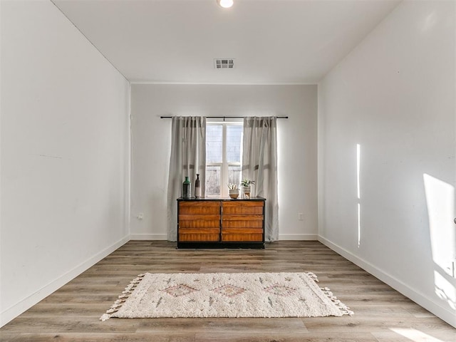 8324 NW 151st Ter, Edmond, OK 73013 - empty room with wood finished floors and baseboards