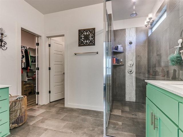 8324 NW 151st Ter, Edmond, OK 73013 - full bath featuring vanity, tiled shower, and a walk in closet