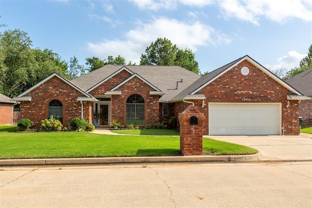 12432 Hastings Rd, Midwest City, OK 73130 - traditional-style house with an attached garage, driveway, a front lawn, brick siding, and a shingled roof