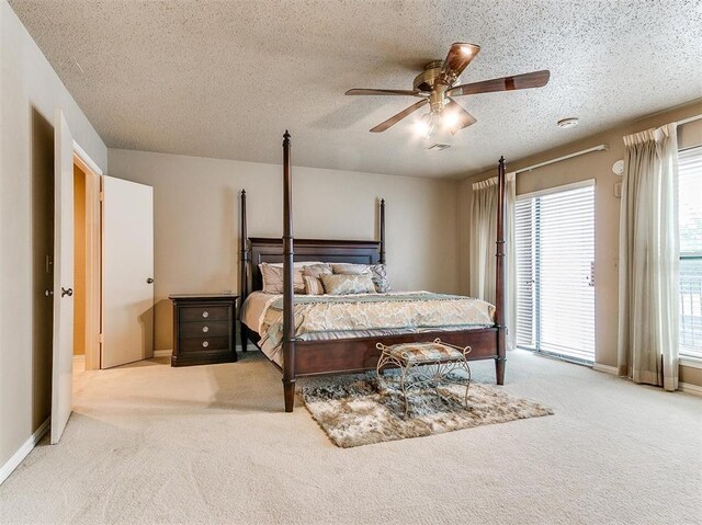 7817 Old Hickory Ln, Oklahoma City, OK 73116 - bedroom featuring carpet floors, access to exterior, a textured ceiling, and ceiling fan