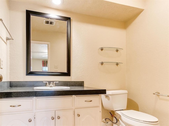 7817 Old Hickory Ln, Oklahoma City, OK 73116 - bathroom with vanity and a textured wall