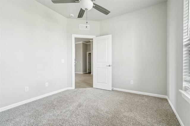 1513 Reid Pryor Rd, Norman, OK 73072 - unfurnished bedroom featuring carpet floors and a ceiling fan
