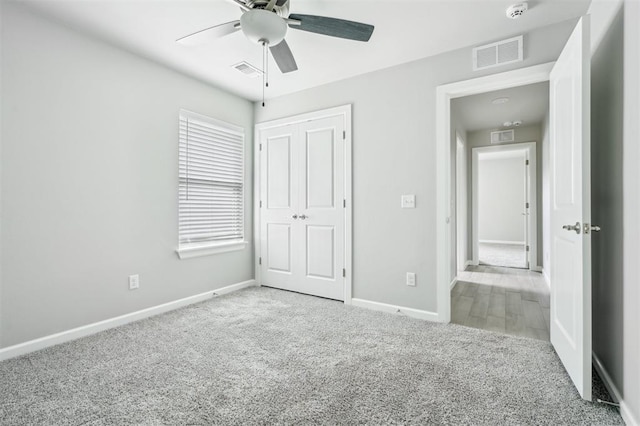 1513 Reid Pryor Rd, Norman, OK 73072 - unfurnished bedroom featuring carpet floors, a closet, and a ceiling fan