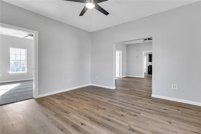501 SW 2nd St, Tuttle, OK 73089 - spare room featuring a ceiling fan, baseboards, and wood finished floors