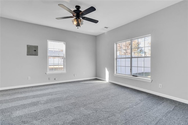 501 SW 2nd St, Tuttle, OK 73089 - spare room with electric panel, healthy amount of natural light, and carpet floors