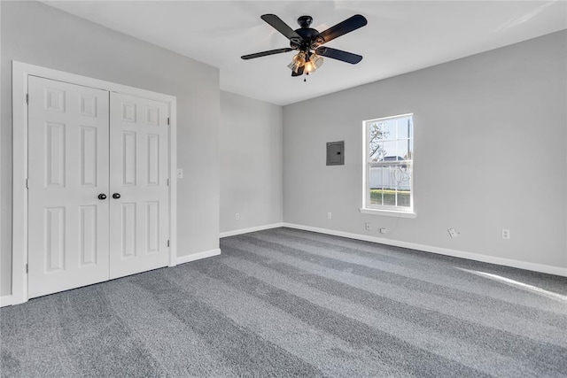 501 SW 2nd St, Tuttle, OK 73089 - unfurnished bedroom featuring electric panel, carpet floors, baseboards, a closet, and ceiling fan