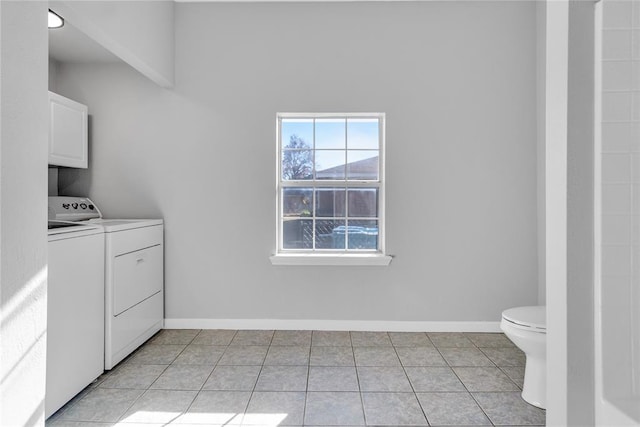 501 SW 2nd St, Tuttle, OK 73089 - laundry room with washing machine and clothes dryer, light tile patterned flooring, and baseboards