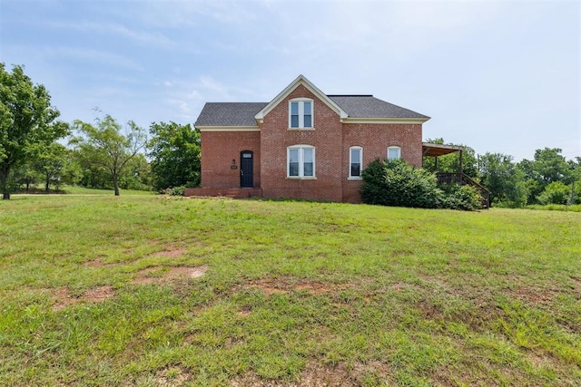 1901 E University Ave, Guthrie, OK 73044 - view of side of property with a lawn and brick siding