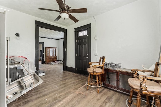 1901 E University Ave, Guthrie, OK 73044 - entryway with ceiling fan and wood finished floors