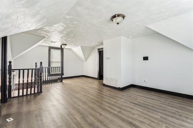 1901 E University Ave, Guthrie, OK 73044 - additional living space with wood finished floors and lofted ceiling