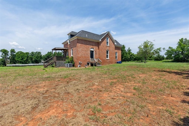 1901 E University Ave, Guthrie, OK 73044 - view of property exterior featuring brick siding and a lawn