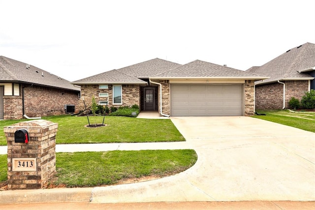 3413 NW 159th St, Edmond, OK 73013 - view of front of property featuring an attached garage, a front yard, driveway, a shingled roof, and brick siding