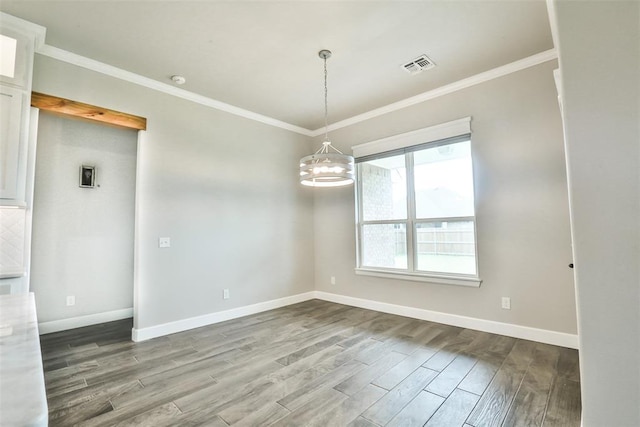 12016 SW 50th St, Mustang, OK 73064 - spare room with wood finished floors, ornamental molding, and a chandelier