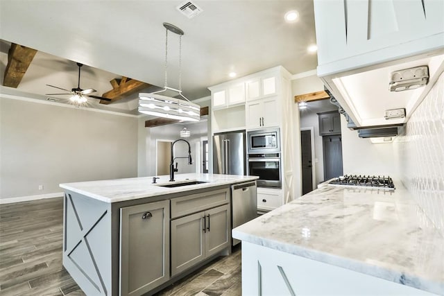 12016 SW 50th St, Mustang, OK 73064 - kitchen featuring appliances with stainless steel finishes, gray cabinetry, recessed lighting, ceiling fan, and light stone countertops