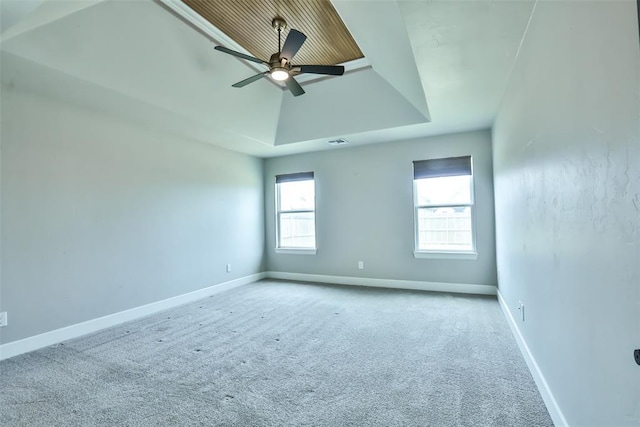 12016 SW 50th St, Mustang, OK 73064 - carpeted spare room featuring a raised ceiling and a ceiling fan