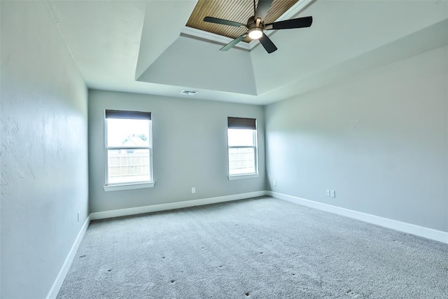 12016 SW 50th St, Mustang, OK 73064 - carpeted spare room featuring a ceiling fan and a tray ceiling